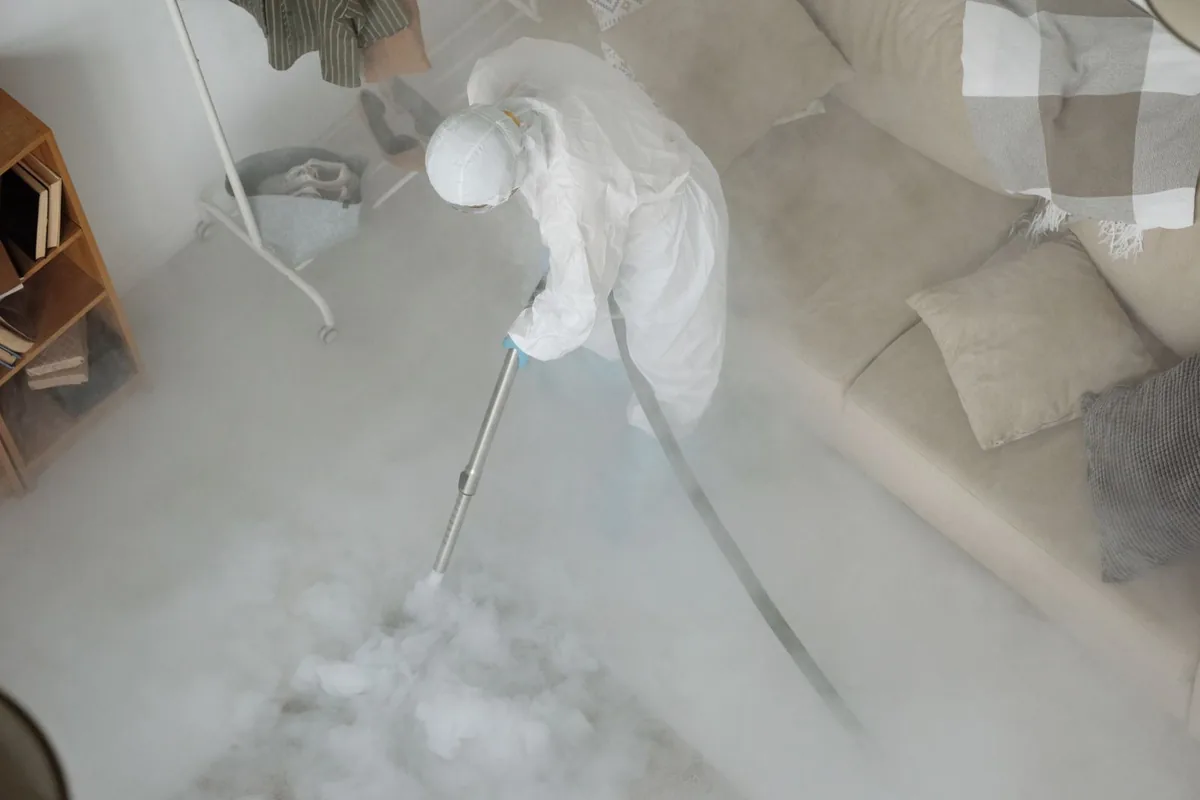 Biohazard cleanup technician in protective equipment, Voorheesville, NY